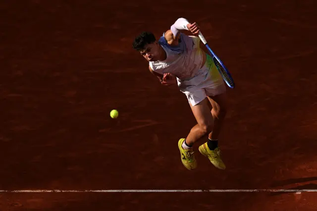 Ben Shelton of United States serves against Carlos Alcaraz