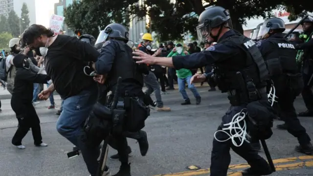 Police detain a protester as they clash in Los Angeles, California, USA, 09 June