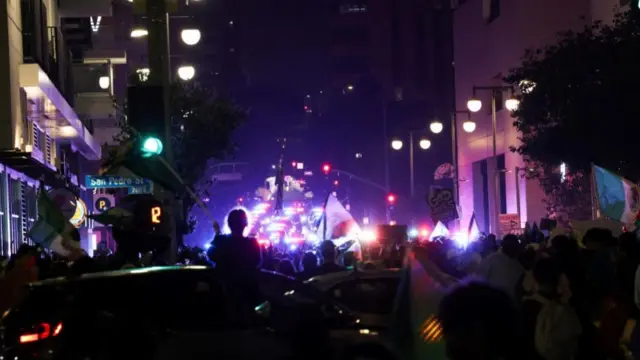 Demonstrators participate in a protest against federal immigration sweeps, in downtown Los Angeles