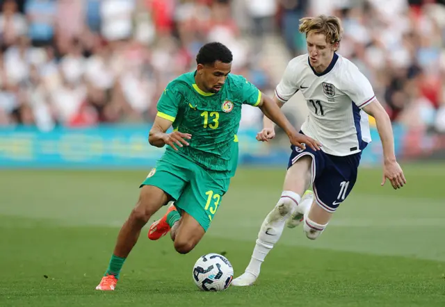 Iliman Ndiaye of Senegal runs with the ball