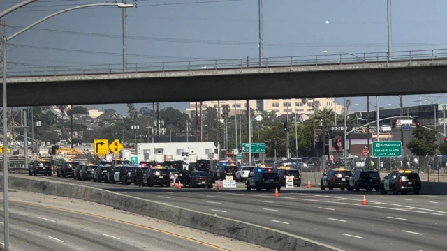 Police cars line a freeway
