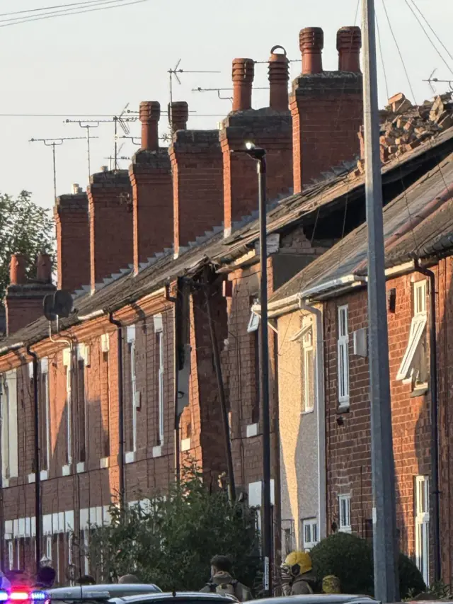 A photo showing a house with its front missing