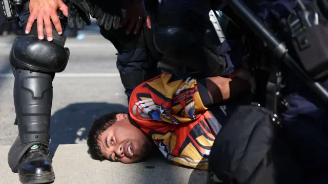 A protestor is arrested during protests in Los Angeles