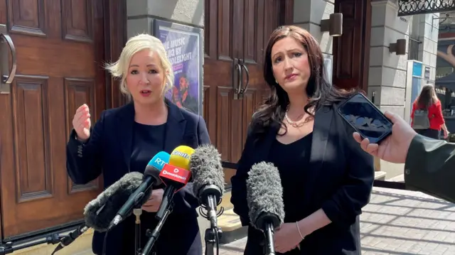 Two women at microphone