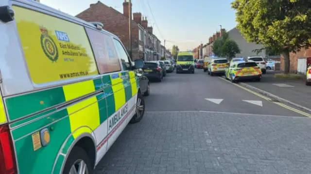 Ambulances and police cars at scene of explosion
