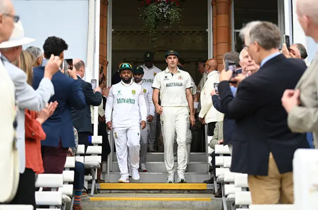 Australia and South Africa walking down the steps