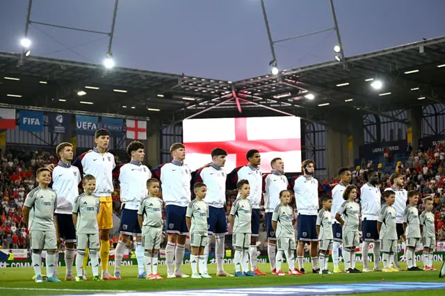 England players stand for the anthems