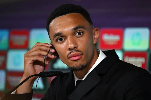 Trent-Alexander Arnold putting in his ear piece