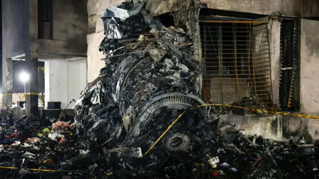 The wreckage of what looks like one the plane engines is seen near a building in Ahmedabad. Photo: 12 June 2025