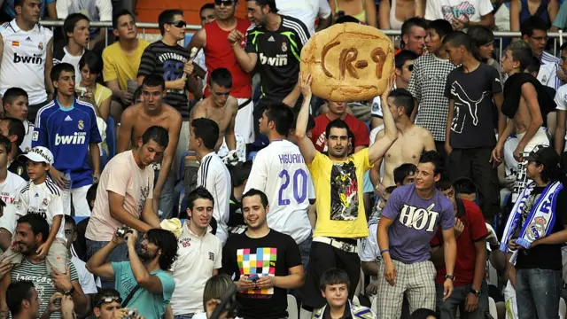 Fan holds up CR9 pastry