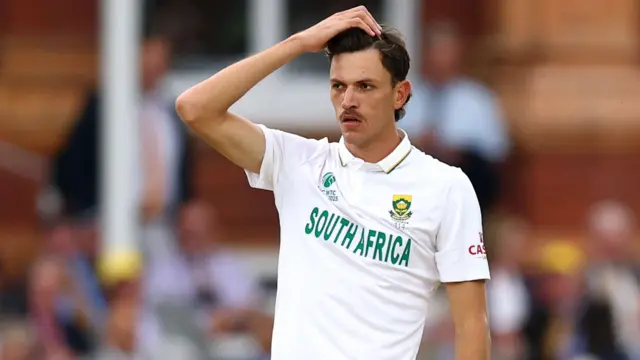 Marco Jansen puts hand on head