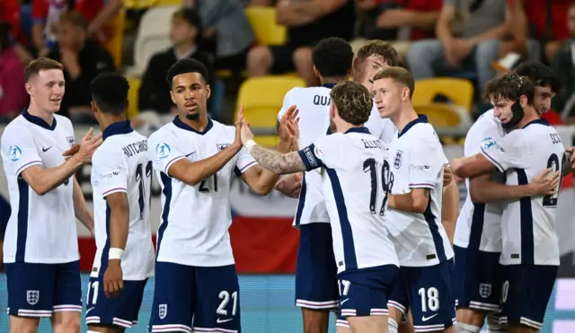 England players celebrate their third goal