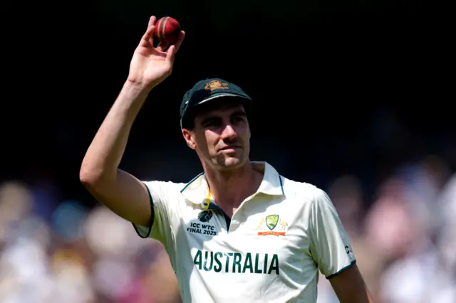 Pat Cummins celebrates taking six wickets