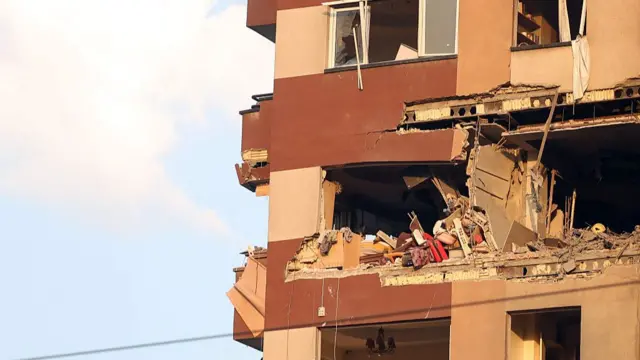 Sunlight shining on a damaged apartment building