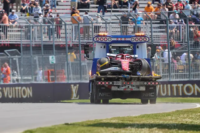 Charles Leclerc's Ferrari being towed away