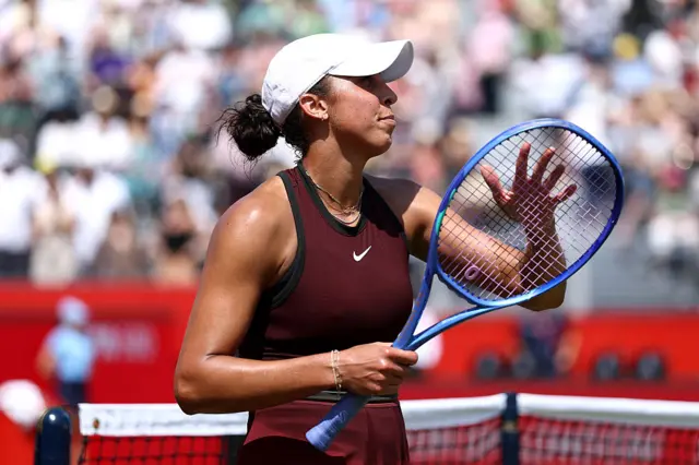 Madison Keys tapping her racquet
