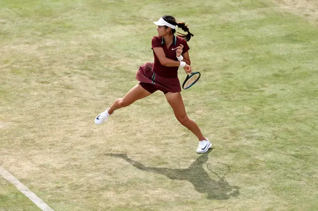 Emma Raducanu hits a forehand