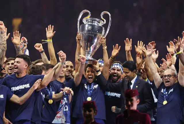 Marquinhos holds up Champions League trophy