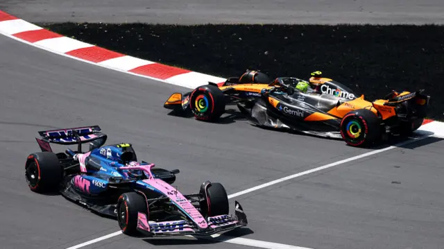McLaren's Lando Norris passes the Alpine of Franco Colapinto, who has spun and is facing the wrong way in Canadian Grand Prix first practice