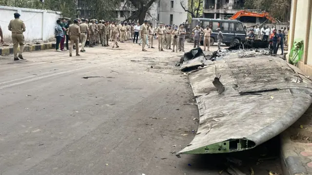 Debris at the site of Air India plane crash in Ahmedabad, India