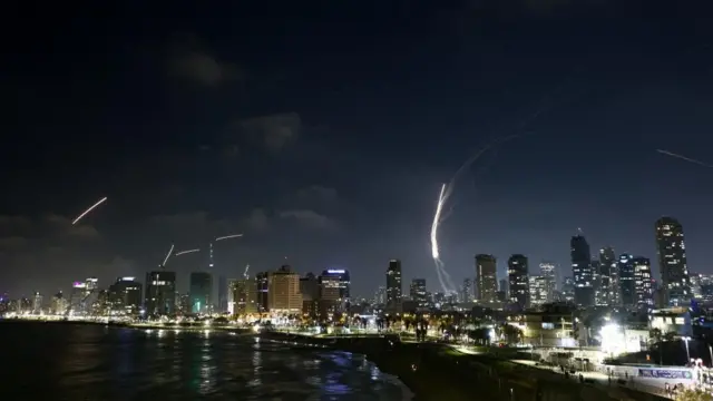 Bright flashes can be seen over Tel Aviv