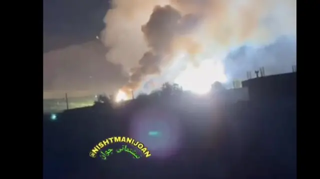 Smoke rising from buildings overnight, there is a social media watermark
