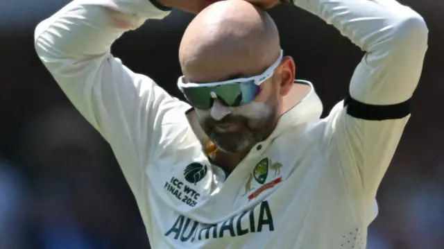 Nathan Lyon has hands on head