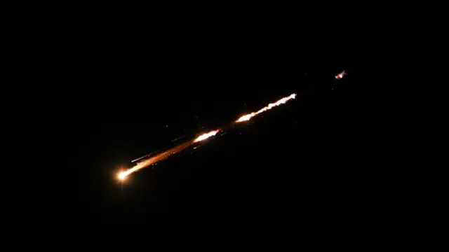 A bright streak of light across the sky