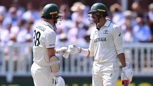 Josh Hazlewood and Mitchell Starc bump fists