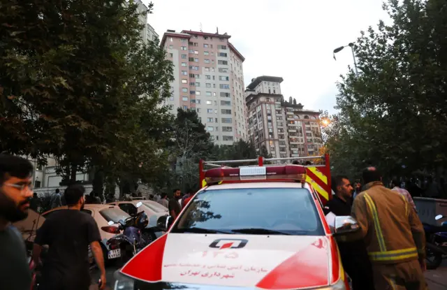 An emergency vehicle is on a Tehran street.