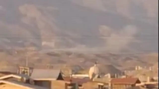 A screengrab from the new footage showing smoke plumes to the west of Tehran