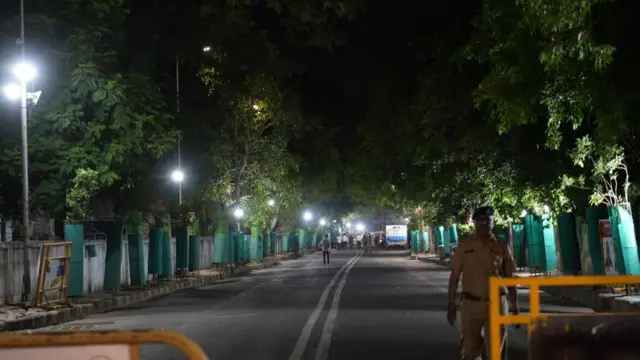 A road in Ahmedabad near the crash site. It is lined with fences.