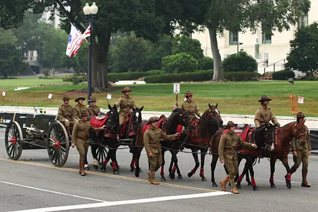 Members of the US Army in period-specific uniforms participate in the 250th birthday parade