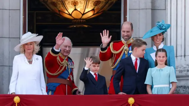 Britain's King Charles, Queen Camilla, Prince William, Prince of Wales, Catherine, Princess of Wales, Prince George, Princess Charlotte and Prince Louis on the balcony at Buckingham Palace.