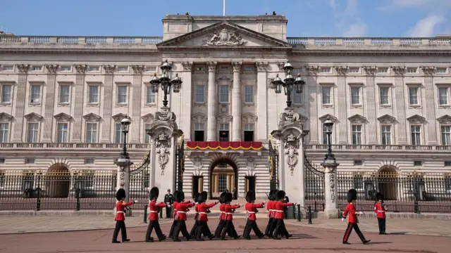Members of the Foot Guards outside Buckingham Palace ahead of Trooping the Colour ceremony.