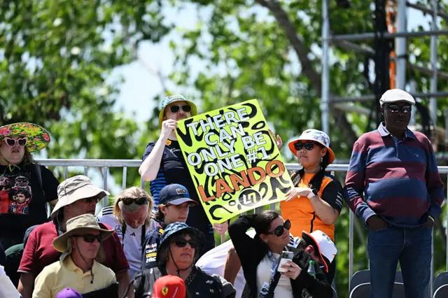 A fan holds up a Lando Norris sign