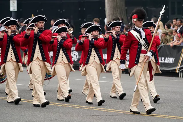 Members of the military in historic uniforms march during the US Army's 250th Anniversary Parade
