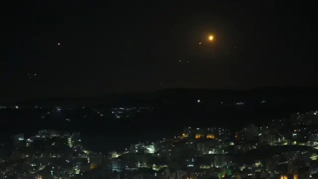 Missiles are seen above the West Bank city of Nablus