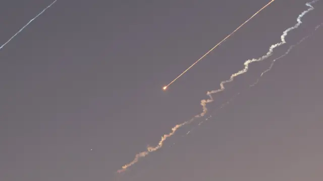 Ballistic missiles and smoke trails from ballistic missiles in the sky