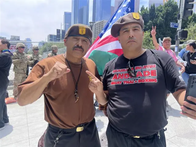 Jose Azetcla (L) protests Donald Trump in Los Angeles