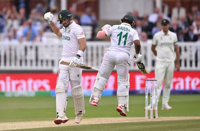 Aiden Markram celebrates his century v Australia with Temba Bavuma