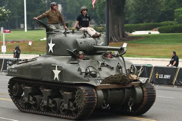 Members of the U.S Army driving in a Sherman tank participate in the 250th birthday parade