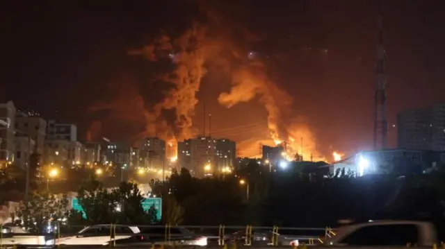 Smoke from an Israeli attack rise from Sharan Oil depot.
