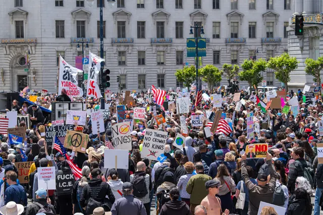 People gather at city hall to protest the Trump administration during the "No Kings" national rally in San Francisco