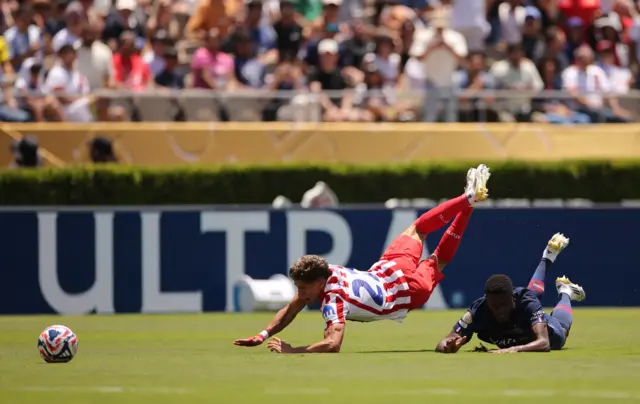 Simeone and Mendes fall to the floor after a coming together