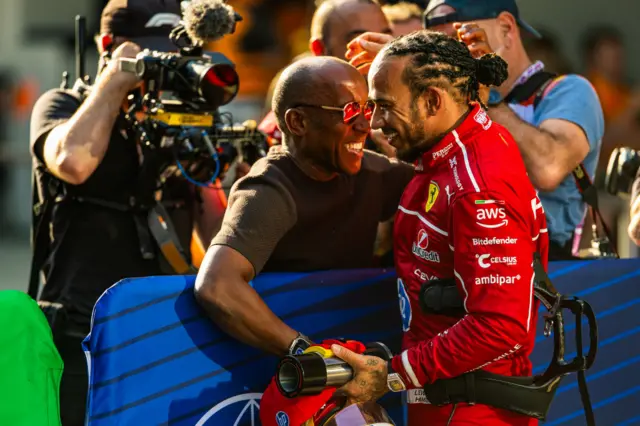 Anthony Hamilton and Lewis Hamilton celebrate together