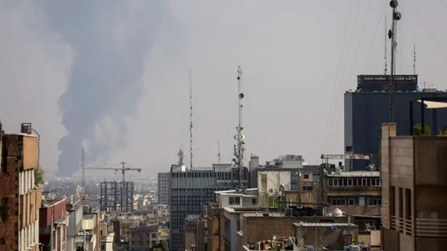 Smoke rises after an Israeli attack on Tehran Oil Refinery