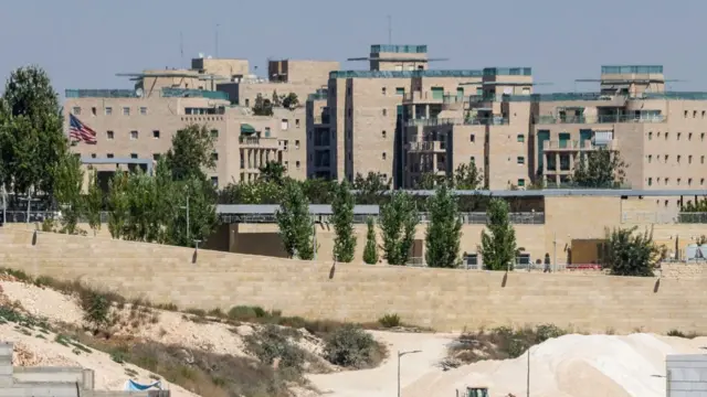 A flag flies inside the US embassy complex in Jerusalem.