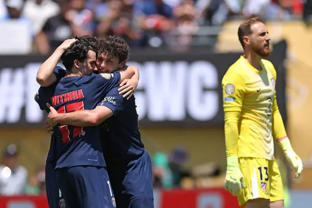 PSG players celebrate a goal as Oblak stands defeated