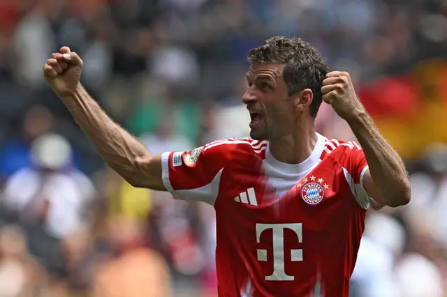 Thomas Muller celebrates scoring for Bayern Munich